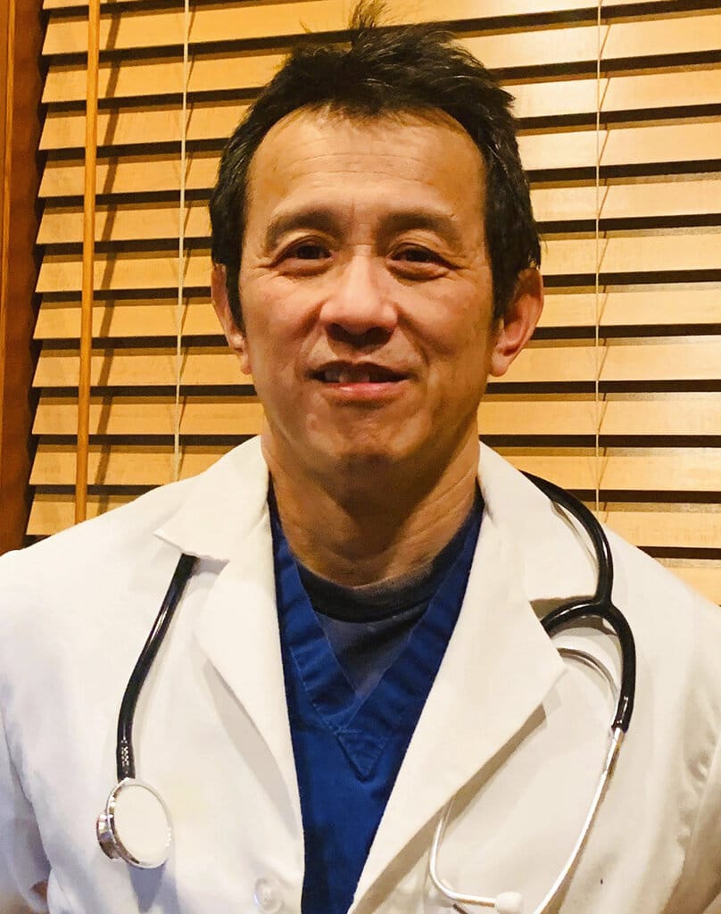 This photo taken March 27, 2020, and provided by Dr. Ming Lin, depicts him at his home in Bellingham, Washington. Lin, who was fired from his position as an emergency room physician at PeaceHealth St. Joseph Medical Center in Bellingham after he publicly complained about the hospital's COVID-19 preparations, sued for wrongful termination on Thursday, May 28, 2020.