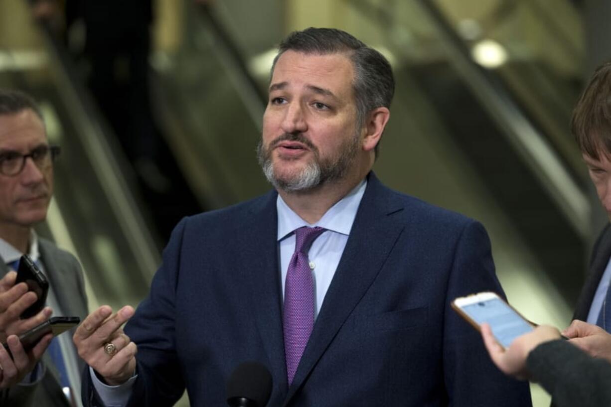 FILE- In this Jan. 21, 2020 file photo, Sen. Ted Cruz, R-Texas., speaks to reporters on Capitol Hill in Washington. Cruz is working on a book, to be published in October, about the Supreme Court. Regnery Publishing announced Monday, May 11 that the Texas Republican would draw upon his long legal background to provide an inside look at key court decisions.