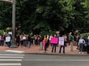 Demonstrators gathered at the corner of West 8th Street and Columbia on Sunday. It was part of protests in cities nationwide following the death of George Floyd in Minneapolis on May 25.