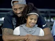 Former Los Angeles Laker Kobe Bryant and his daughter Gianna pictured here in July 2018.