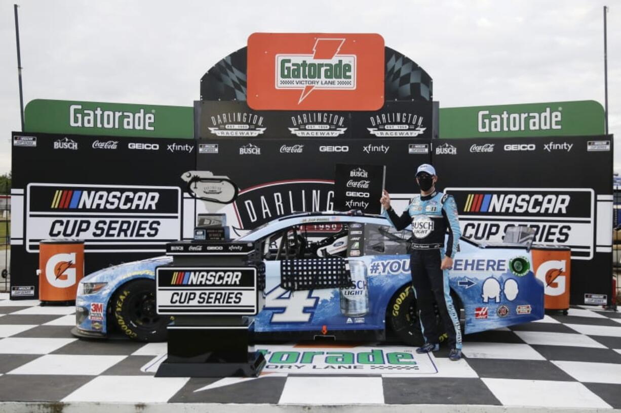 Kevin Harvick celebrates after winning the NASCAR Cup Series auto race Sunday, May 17, 2020, in Darlington, S.C.