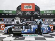 Kevin Harvick celebrates after winning the NASCAR Cup Series auto race Sunday, May 17, 2020, in Darlington, S.C.