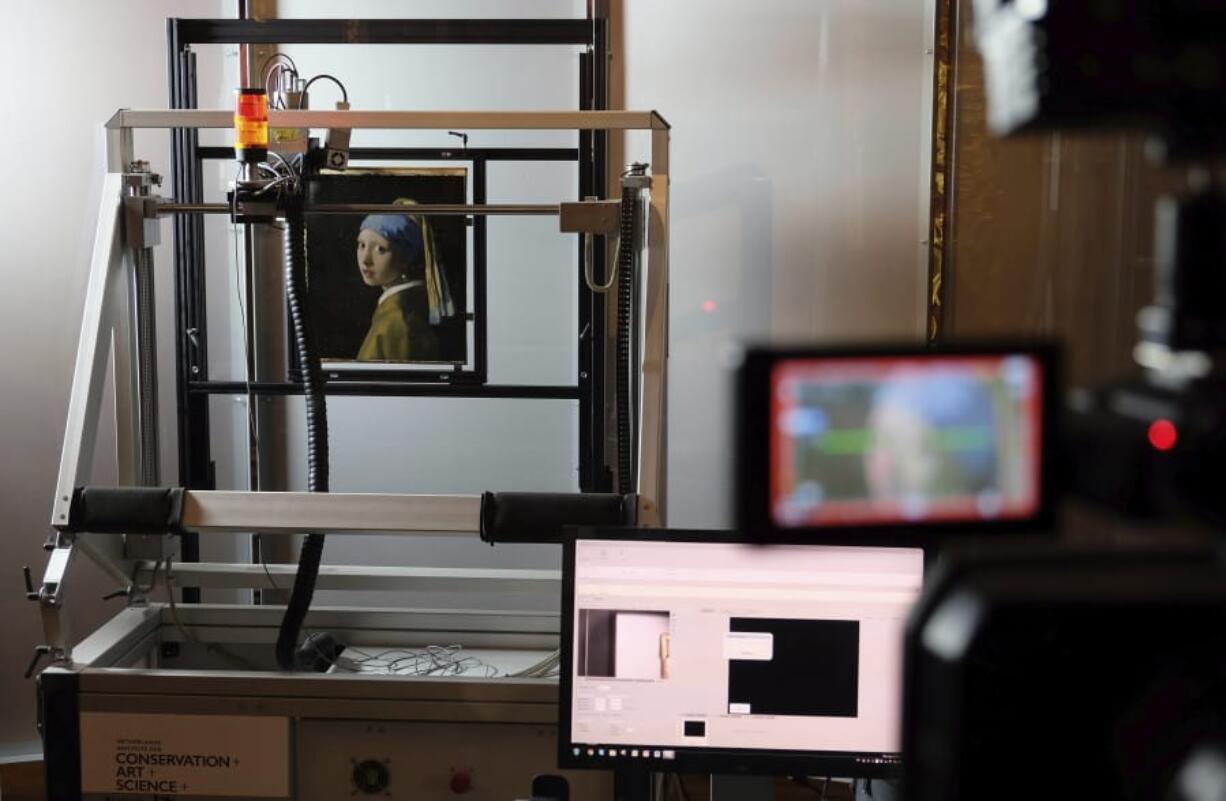 A macro XRF scanner is used Feb. 26 to study in minute detail the surface of Johannes Vermeer&#039;s 17th century masterpiece &quot;Girl With a Pearl Earring,&quot; at the Mauritshuis museum in The Hague, Netherlands.