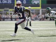 FILE - In this Sept. 22, 2019, file photo, New England Patriots wide receiver Phillip Dorsett, left, runs from New York Jets cornerback Nate Hairston (21) on the way for a touchdown after a reception during an NFL football game in Foxborough, Mass. Dorsett has never set foot in Seattle or anywhere in the Pacific Northwest. Not as a player in either of his previous NFL stops. Not in college. Not just for a random trip. He hasn&#039;t even seen in person the the place he&#039;ll practice after signing with the Seattle Seahawks whenever the facility becomes available to use.