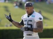 FILE - In this July 25, 2019, file photo, Carolina Panthers&#039; Bruce Irvin (55) stretches during practice at the NFL football team&#039;s training camp in Spartanburg, S.C. Irvin jumped at the chance to return to Seattle this offseason, but his reunion with the Seahawks comes with the expectation he can help a lackluster pass rush.