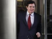 FILE- In this Nov. 6, 2017 file photo, Paul Manafort, President Donald Trump&#039;s former campaign chairman, leaves the federal courthouse in Washington. Manafort has been released from federal prison to serve the rest of his sentence in home confinement over concerns about the coronavirus, his lawyer said Wednesday.