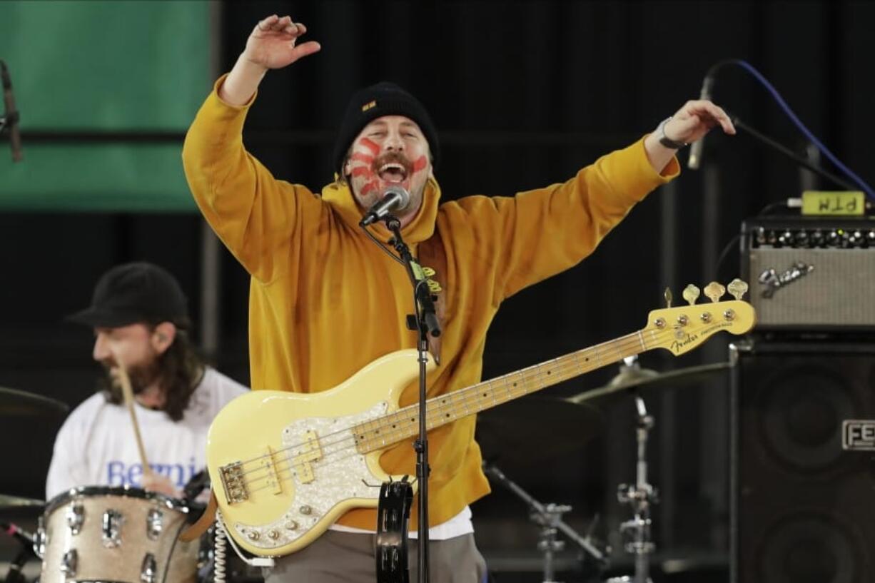 FILE - In this Feb. 17, 2020 file photo, Zachary Scott Carothers performs with his rock band &quot;Portugal. The Man&quot; during a campaign event for Democratic presidential candidate Sen. Bernie Sanders in Tacoma, Wash.  After the school board at the Matanuska-Susitna Borough School District in Palmer voted 5-2  to remove five classics including F. Scott Fitzgerald&#039;s &quot;The Great Gatsby,&quot; &quot;Joseph Heller&#039;s Catch-22&quot; and Maya Angelou&#039;s &quot;I Know Why the Caged Bird Sings,&quot; the band announced it would buy the books for any student or parent who wanted them. (AP Photo/Ted S.