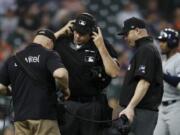 Home plate umpire Paul Emmel and umpire Mike Estabrook reviewing a play during a game last season. Major League Baseball and its umpires have reached a deal to cover a 2020 pay structure during the coronavirus pandemic. As part of the deal, MLB has the right not to use instant replays of umpires&#039; decisions during the 2020 season.