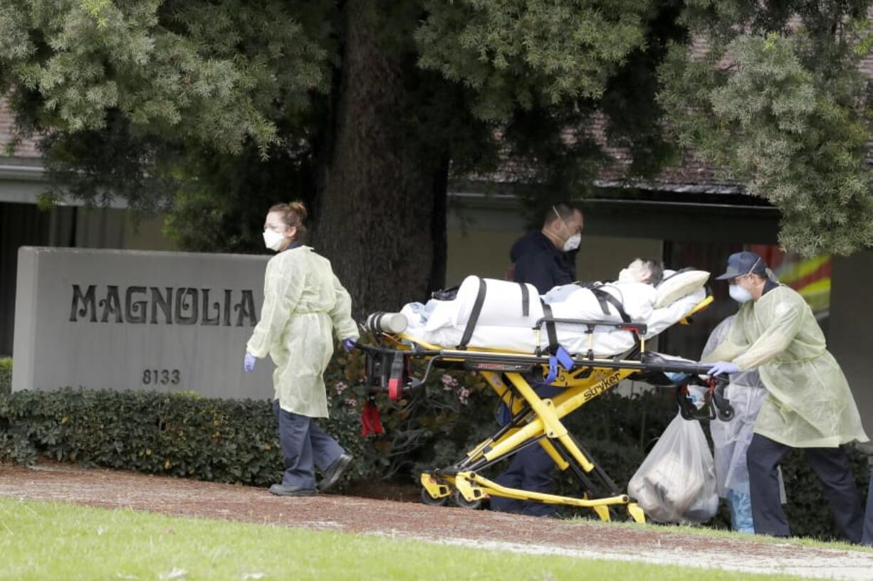 A patient at Magnolia Rehabilitation and Nursing Center in Riverside, Calif., is evacuated April 8 to a waiting ambulance. For nearly two months, many nursing homes nationwide have been on virtual lockdown. Families of residents are not allowed inside, vendors have to drop deliveries outside and the only people coming in and out are health care workers and assistants.