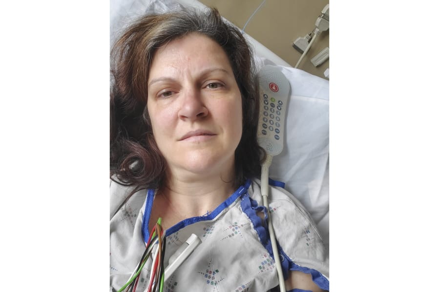 This May 6, 2020 photo provided by Darlene Gildersleeve, 43, of Hopkinton, N.H. shows her at a Manchester, N.H. hospital. Gildersleeve thought she had recovered from COVID-19. Doctors said she just needed rest. And for several days, no one suspected her worsening symptoms were related -- until a May 4 video call, when her physician heard her slurred speech and consulted a specialist. &quot;You&#039;ve had two strokes,&#039;&#039; a neurologist told her at the hospital.