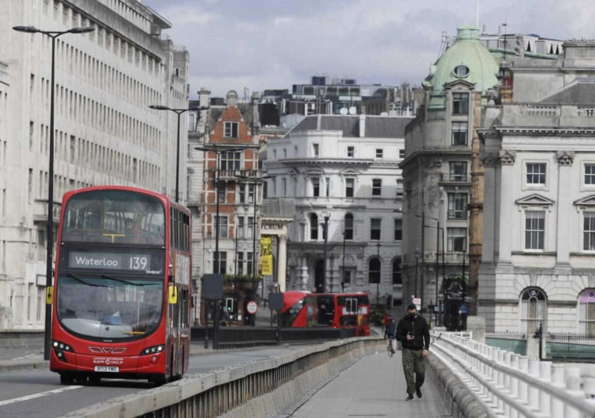 A quiet Waterloo Bridge in London, Wednesday, May 13, 2020, as the country continues in lockdown to help stop the spread of coronavirus. Some of the coronavirus lockdown measures are being relaxed in England on Wednesday, with those workers who are unable to work from home, such as those in construction and manufacturing, encouraged to return to work.