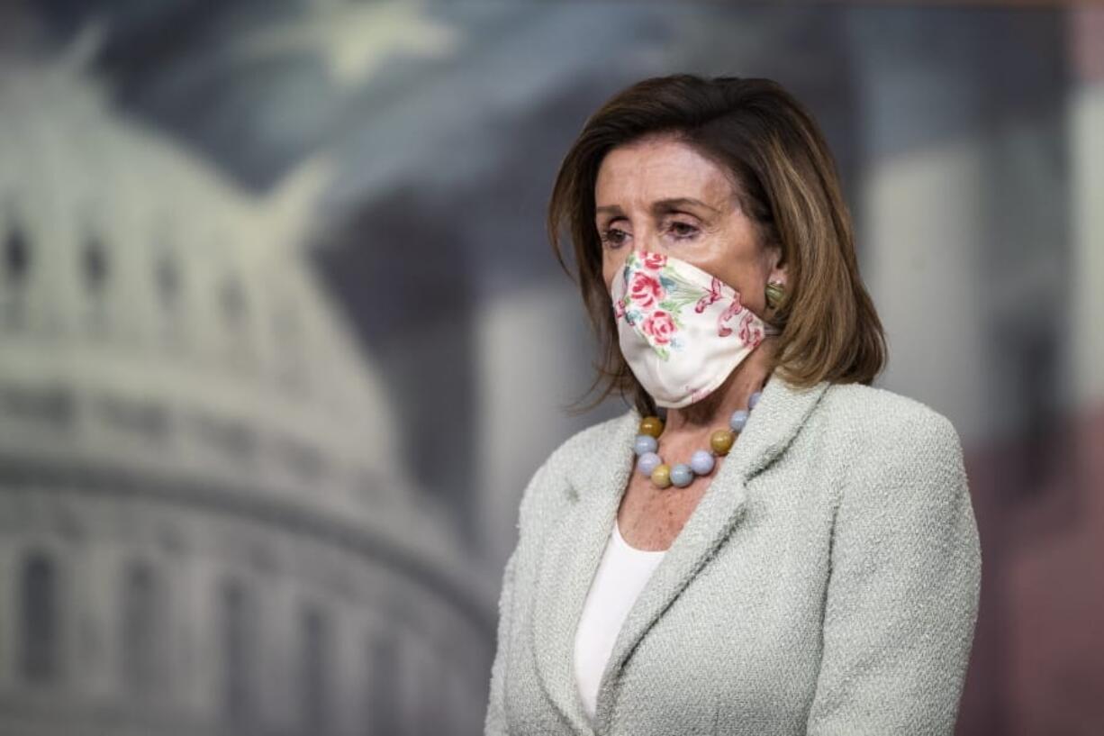 House Speaker Nancy Pelosi of Calif., listens to questions during a news conference on Capitol Hill, Wednesday, May 27, 2020, in Washington.