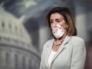 House Speaker Nancy Pelosi of Calif., listens to questions during a news conference on Capitol Hill, Wednesday, May 27, 2020, in Washington.