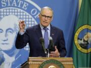 FILE - In this Monday, April 13, 2020, file photo, Washington Gov. Jay Inslee speaks during a news conference at the Capitol in Olympia, Wash. Inslee has repeatedly said he will rely on scientific models and input from state health officials to determine when stay-at-home orders can be relaxed, despite growing calls for them to be ended, including a protest that drew about 2,500 to the state Capitol. (AP Photo/Ted S.