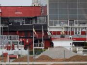 The grandstand near the finish line at Pimlico Race Course is seen empty, Friday, May 15, 2020, in Baltimore. The Preakness would have been run Saturday, May 16, 2020, in Baltimore. But Pimlico Race Course and many tracks across North America remain dark because of the coronavirus pandemic.