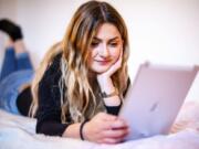 Bianca Amodeo, 17, uses her tablet in her room at home in Ascoli Piceno, central Italy, Thursday, April 30, 2020 to chat with her boyfriend Francesco who lives in Ancarano, 15 minutes driving from home. Bianca and Francesco have not met for almost two months after Italy went in a general lockdown in a bid to fight the new coronavirus pandemic. While Italian Premier Conte announced the first relaxation of the circulation restrictions starting from May 4, Bianca and Francesco won&#039;t be able to meet yet because they live in different regions.