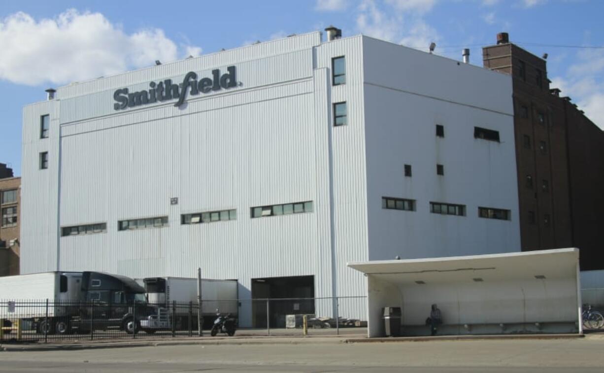 FILE - This April 8, 2020 file photo, shows the Smithfield pork processing plant in Sioux Falls, S.D. The union representing employees at the South Dakota pork processing plant says it will partially reopen on Monday, May 4, 2020, after shuttering more than two weeks ago because of a coronavirus outbreak that infected hundreds of employees.