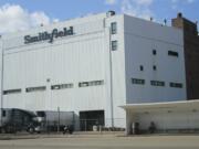 FILE - This April 8, 2020 file photo, shows the Smithfield pork processing plant in Sioux Falls, S.D. The union representing employees at the South Dakota pork processing plant says it will partially reopen on Monday, May 4, 2020, after shuttering more than two weeks ago because of a coronavirus outbreak that infected hundreds of employees.