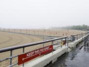 New York City Parks officials work at an empty Orchard Beach Saturday, May 23, 2020, in the Bronx borough of New York.  Gov. Andrew Cuomo has given New Yorkers an unexpected reprieve from cabin fever by easing the state&#039;s ban on gatherings due to coronavirus concerns, in time for the Memorial Day weekend.   New York City beaches are open this weekend. But no swimming is allowed, and masks must be worn.