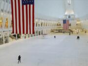 Pedestrians walk through the nearly empty Oculus during the coronavirus pandemic Saturday, May 9, 2020, in New York.