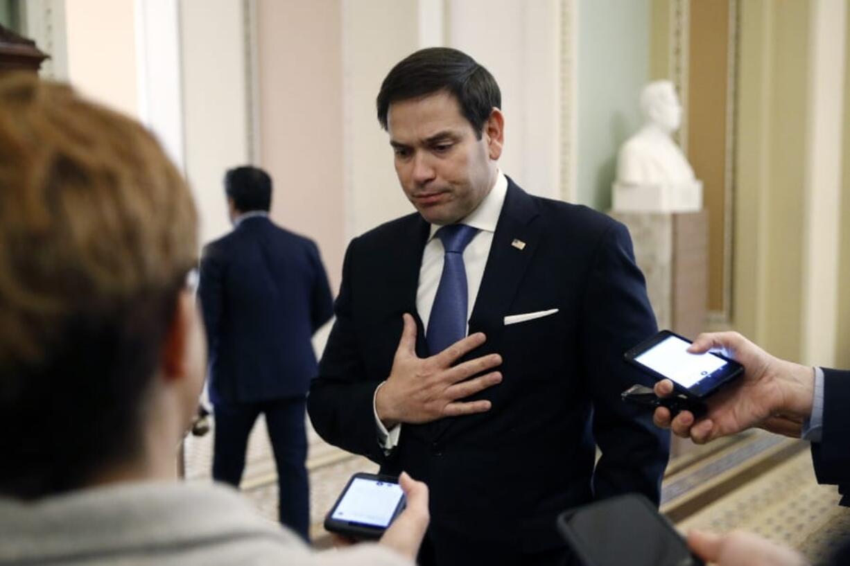 FILE - In this March 24, 2020, file photo, Sen. Marco Rubio, R-Fla., speaks with reporters on Capitol Hill in Washington. Rubio predicted in an interview with The Associated Press on Tuesday, May 26, that foreign actors will seek to amplify American conspiracy theories about the virus and find new ways to interfere in the 2020 presidential election, much as Russia did in 2016.