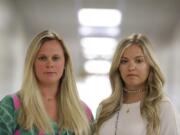 First grade teachers, Ellie Morgan, 25, left, Hannah Sprayberry, 28, right, pose for a portrait, and say they are taking around 5 per-cent pay cut on Thursday, May 28, 2020, in Fort Oglethorpe, Ga. With sharp declines in state spending projected because of the economic fallout from the COVID-19 pandemic, America&#039;s more than 13,000 local school systems are wrestling with the likelihood of big budget cuts.