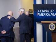 FILE - In this Thursday, April 16, 2020 file photo, Centers for Disease Control and Prevention Director Dr. Robert Redfield, left, and Dr. Anthony Fauci, director of the National Institute of Allergy and Infectious Diseases, depart after accompanying President Donald Trump as he speaks about the coronavirus in the James Brady Press Briefing Room of the White House in Washington. Faith and science are both under unprecedented pressures during a pandemic that&#039;s asked them to deliver comfort or certainty -- while at times straining their relationship. But for some leaders of the U.S. pandemic response, the two have worked in concert.