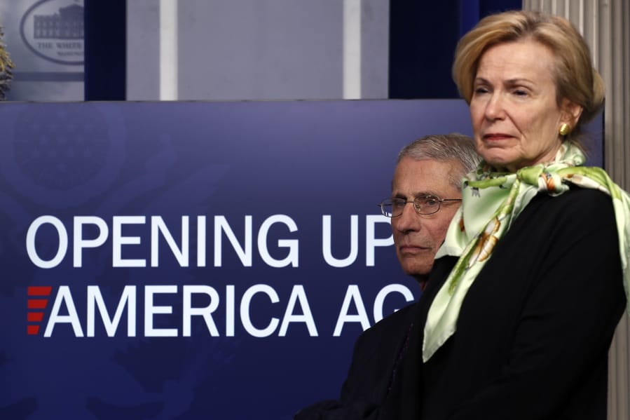 FILE - In this April 16, 2020, file photo, Dr. Anthony Fauci, director of the National Institute of Allergy and Infectious Diseases, and Dr. Deborah Birx, White House coronavirus response coordinator, listen during a briefing about the coronavirus in the James Brady Press Briefing Room of the White House in Washington. The Trump administration has shelved a set of detailed documents created by the nation&#039;s top disease investigators meant to give step-by-step advice to local leaders deciding when and how to reopen mass transit, day care centers, restaurants, bars and other public places during the still-raging pandemic.