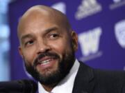 FILE - In this Dec. 3, 2019, file photo, Washington NCAA college football defensive coordinator Jimmy Lake speaks during a news conference about taking over the head coaching position, in Seattle. Just when it seemed like things were up and rolling, the COVID-19 pandemic hit. The ensuring national shutdown hurt coaches across college football as they prepare for next season, but it was particularly difficult on programs with first-year coaches trying to build something from the ground up.