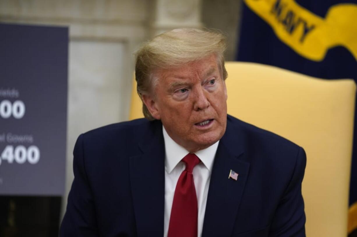 President Donald Trump speaks during a meeting about the coronavirus response with Gov. Greg Abbott, R-Texas, in the Oval Office of the White House, Thursday, May 7, 2020, in Washington.