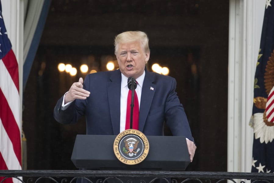 In this Friday, May 22, 2020, photo, President Donald Trump speaks during a &quot;Rolling to Remember Ceremony,&quot; to honor the nation&#039;s veterans and POW/MIA, from the Blue Room Balcony of the White House in Washington. Trump booked back-to-back Memorial Day appearances despite the coronavirus pandemic, at Arlington National Cemetery and at a historic fort in Baltimore.