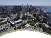 Downtown Seattle and mostly empty streets are shown, Wednesday, May 27, 2020, as viewed from the Space Needle. Many workers continue to work from home due to stay-at-home orders intended to prevent the further spread of the coronavirus. (AP Photo/Ted S.