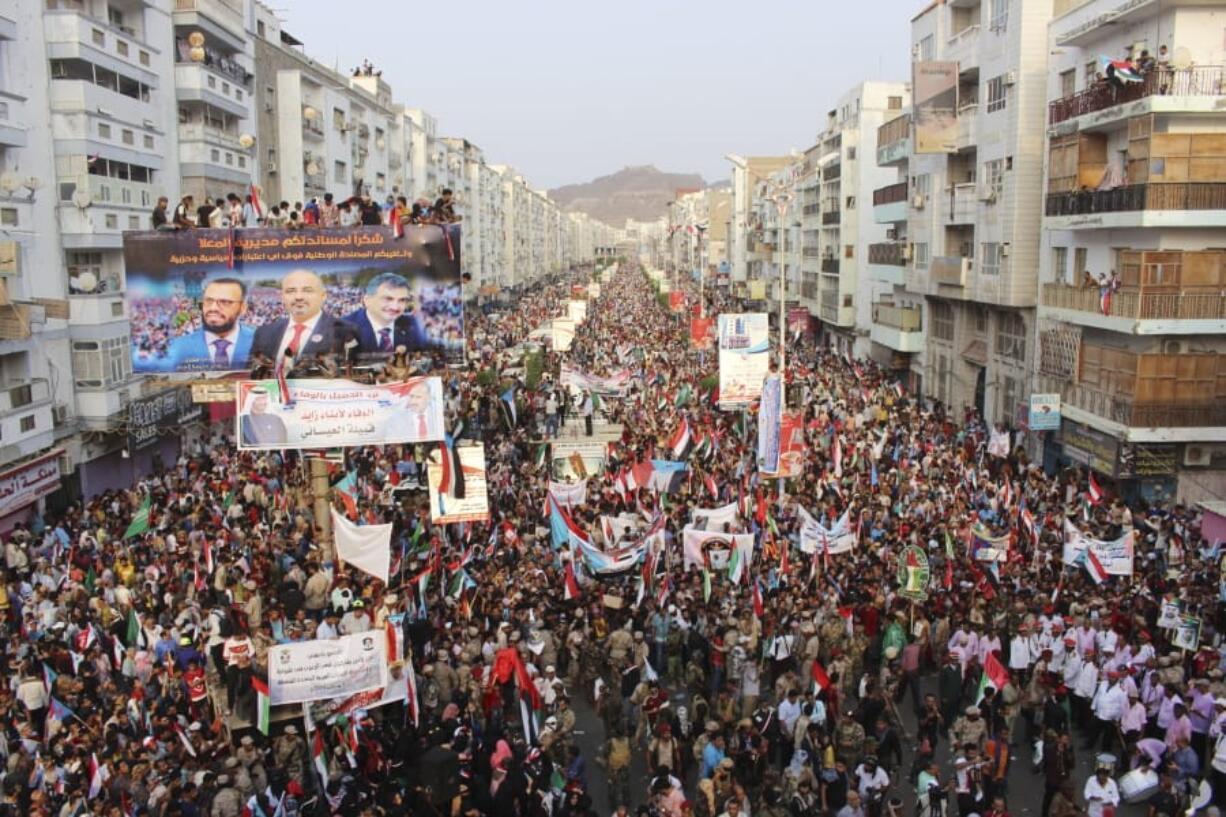 FILE - In this Sept. 5, 2019 file photo, supporters of southern separatists gather with the flags of south Yemen and the United Arab Emirates during a rally to show support for the UAE amid a standoff with the internationally recognized government, in Aden, Yemen. A bid by separatists funded by the UAE to assert control over Yemen&#039;s south has reopened a dangerous front in the country&#039;s civil war and pushed Yemen closer to fragmentation. The separatists&#039; recent declaration of self-rule over the key port city of Aden and other southern provinces also throws into question the roles of Saudi Arabia and the Emirates in the conflict, now in its sixth year.