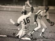 Prairie&#039;s Ryan Issacson fields a throw as Columbia River&#039;s Matt Grammer slides into second base during a game on April 1, 1989. Prairie, which won that game 2-0, would go on to claim the AA state championship that year.