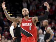 Portland Trail Blazers guard Damian Lillard urges on the crowd after scoring during the second half of the team&#039;s NBA basketball game against the Houston Rockets in Portland, Ore., Wednesday, Jan. 29, 2020. The Blazers won 125-112.