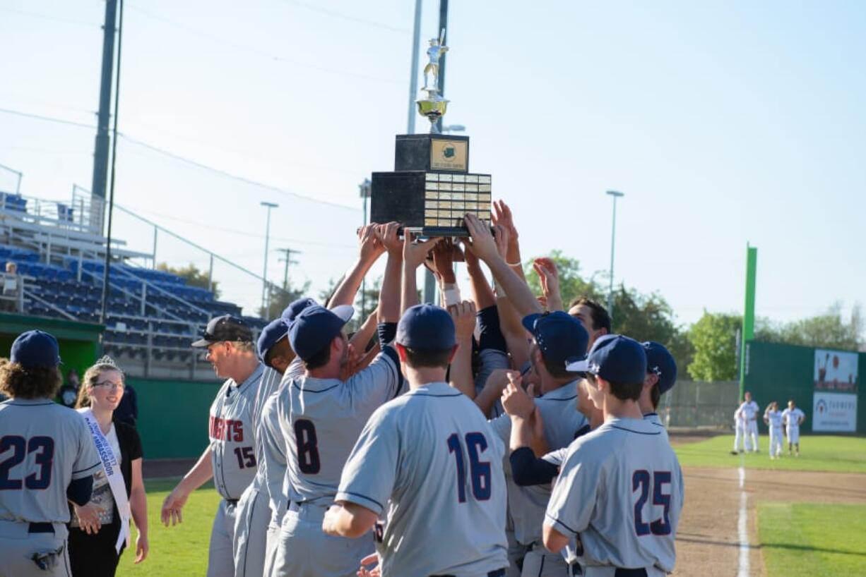 King's Way Christian baseball players hoist the championship trophy after beating Cedar Park Christian in 2017.