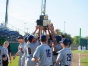 King's Way Christian baseball players hoist the championship trophy after beating Cedar Park Christian in 2017.