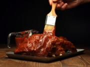 A homemade barbecue sauce on ribs.