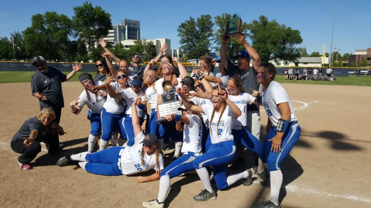 Paul Valencia/The Columbian 
 Members of the La Center softball team pose with the championship trophy after winning the 1A state title.