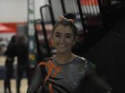 Wayne Havrelly/Post-Record 
Washougal senior gymnast Shaela Ausmus qualified for the 1A/2A/3A state meet after a three-year absence from gymnastics because of back problems. 
Wayne Havrelly/Post-Record 
Washougals Paris Krecklow (left) shows support for her teammate and friend, Shaela Ausmus, at the 1A/2A/3A state gymnastics meet in Bellevue on Feb. 21. 
Wayne Havrelly/Post-Record 
Washougals Shaela Ausmus catapults off the vault at the 1A/2A/3A state gymnastics championships at Lake Sammamish High School on Feb. 21.