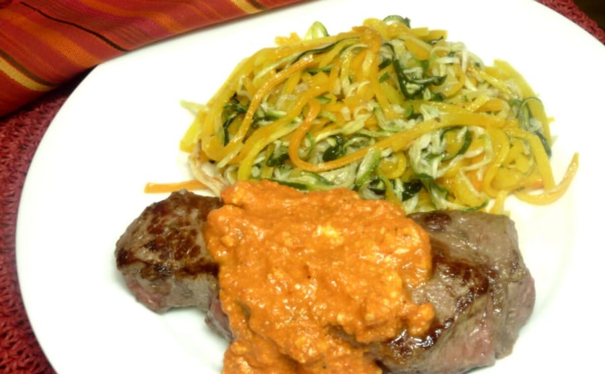 Strip Steak With Romesco Sauce and Spiral Zucchini and Butternut Squash.