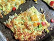 This vegetarian pizza is made with shredded zucchini, mozzarella and Parmesan cheeses and egg.