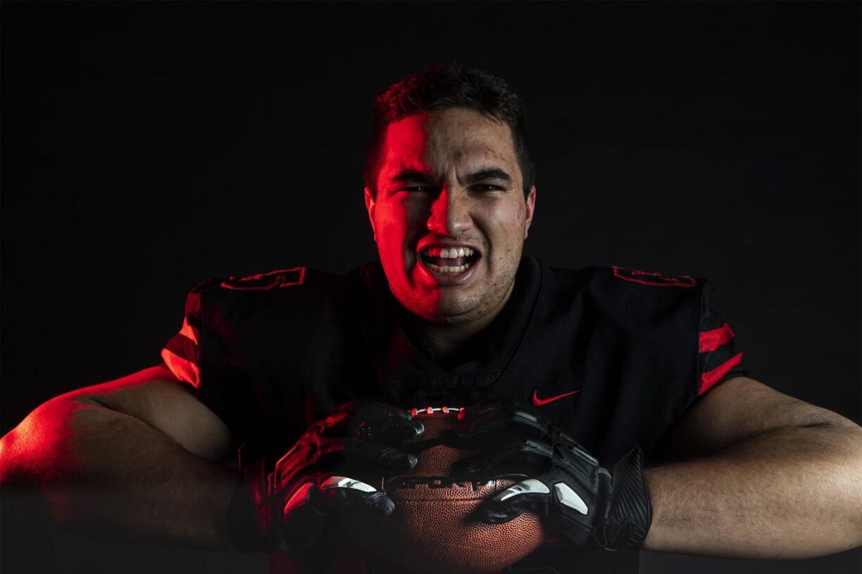 Camas senior Tai Tumanuvao poses for a press photo in The Columbian studio on Wednesday afternoon, Dec. 13, 2019.