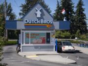 A customer stops by the Dutch Bros. Coffee stand at 9913 Northeast Hazel Dell Ave. The stand closed for a deep cleaning on Saturday after the company announced that one of the employees had tested positive for COVID-19.