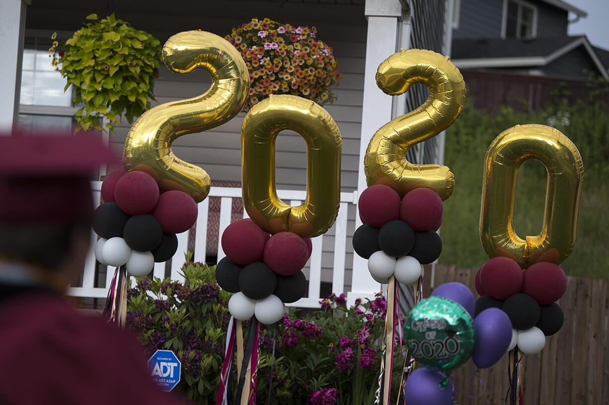 Families in Orchards gather to celebrate the Class of 2020 with a neighborhood graduation ceremony June 5.