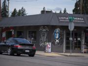 A motorist drives past Limitless America, a firearm retailer in Washougal in June 2020.