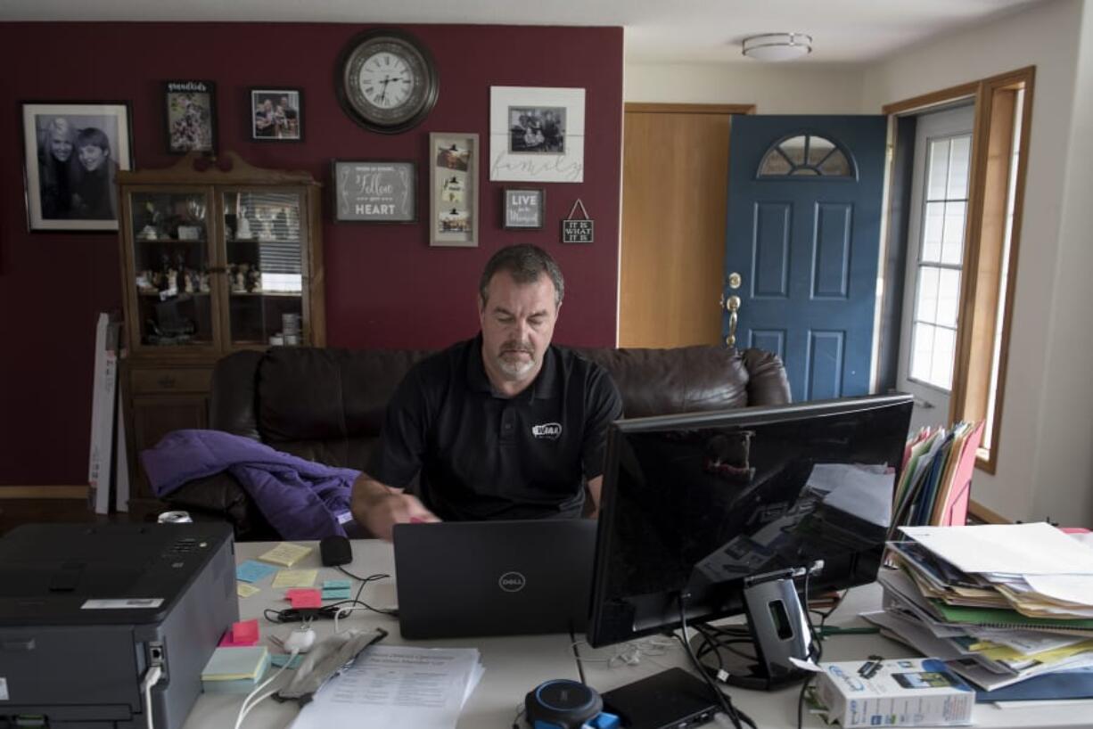 Mick Hoffman, the executive director of the Washington Interscholastic Activities Association, works from home on Monday afternoon, June 15, 2020.