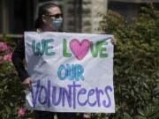 Guest services concierge Sharon Guajardo greets volunteers during a motorcade at PeaceHealth Southwest Medical Center in June 2020.