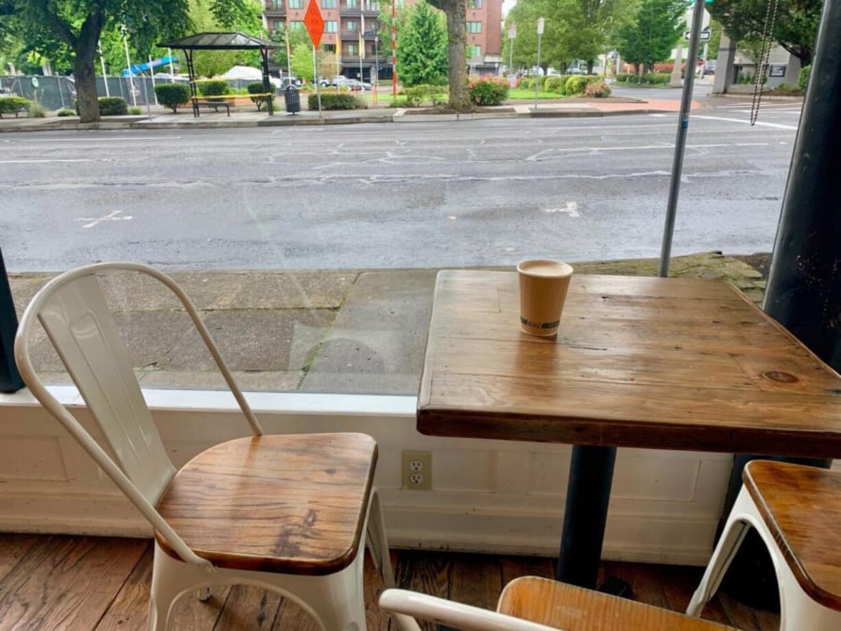 A table tucked in the corner at Compass Coffee is a cozy place to enjoy a chai.