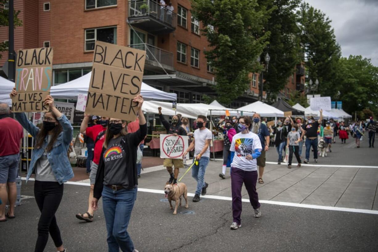 About a hundred community members march through the Vancouver Farmers Market to advocate and celebrate the Black queer and transgender community. Southwest Washington Communities United for Change founder and President Lexi Bongiorno said she wanted to create an opportunity for the community to celebrate Pride but also stay aligned and honor the Black Lives Matter movement.